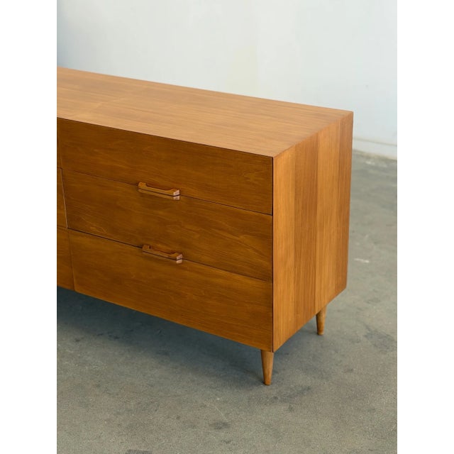 W60 D19 H30 Fully restored minimal dresser with updated ball bearing side rails. Item is structurally sound and fully...
