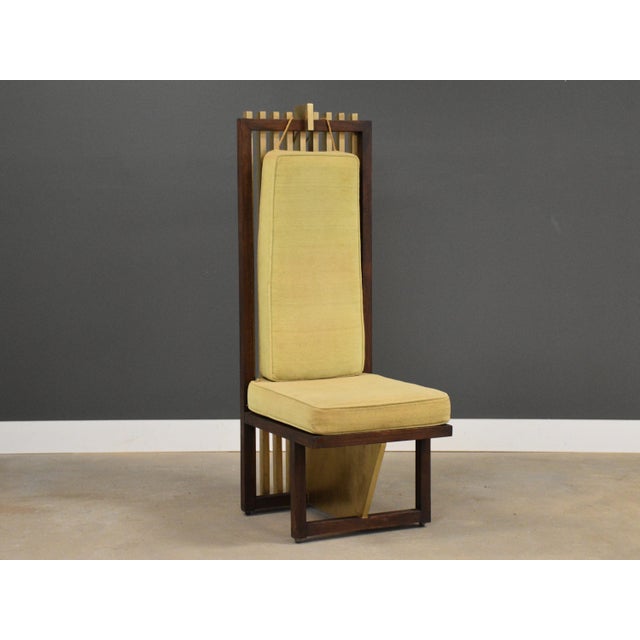 A solid mahogany and gold accent dining chair or lounge chair with original yellow fabric. Circa 1980’s. Seat height is...