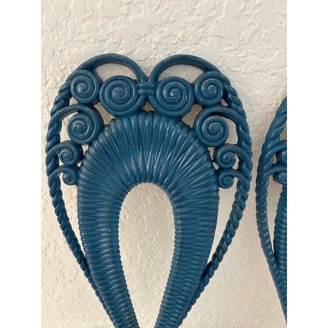 Ornate pair of 1975 Burwood Products molded resin wall candle sconces painted in a shade of Sea blue. Hardware on back for...