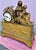 An elegant 19th century French mantel clock crafted in finely cast gilt bronze. The composition features a sculptural...