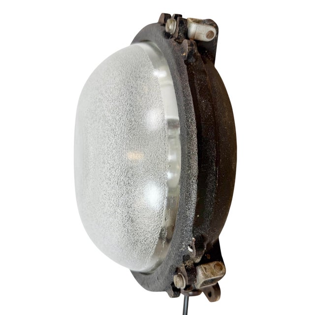 Industrial wall or ceiling light made by Elektrosvit in former Czechoslovakia during the 1960s. It features a cast iron...