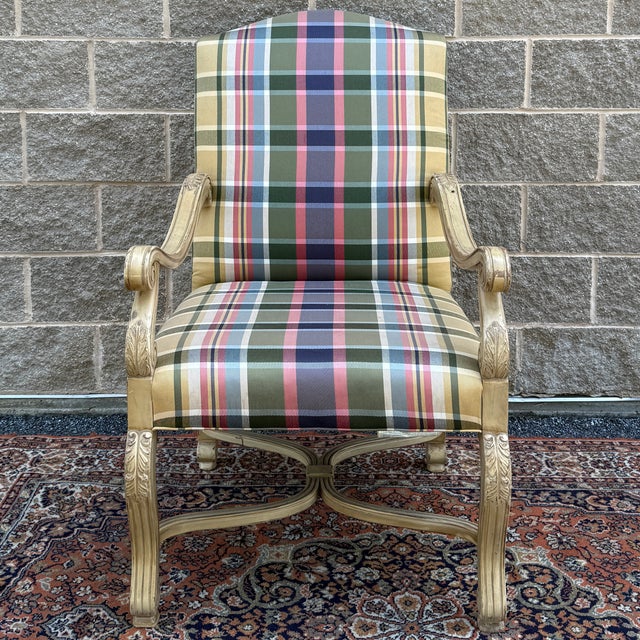 A vintage Southwood Furniture French Neoclassical style lounge chair featuring scrolled arms and legs with carved acanthus...