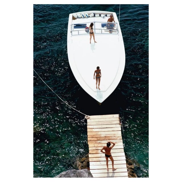 Slim Aarons, Speedboat Landing, Estate Stamped Photographic Print, 1973 / 2020s For Sale