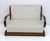 Early Art Deco period Northern Italian sofa, in walnut and ivory velvet upholstery, the back of the sofa is gracefully...