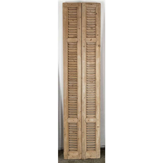 Pair of bleached antique French shutters featuring wonderful time-worn character and patina. Ideal for use as decorative...