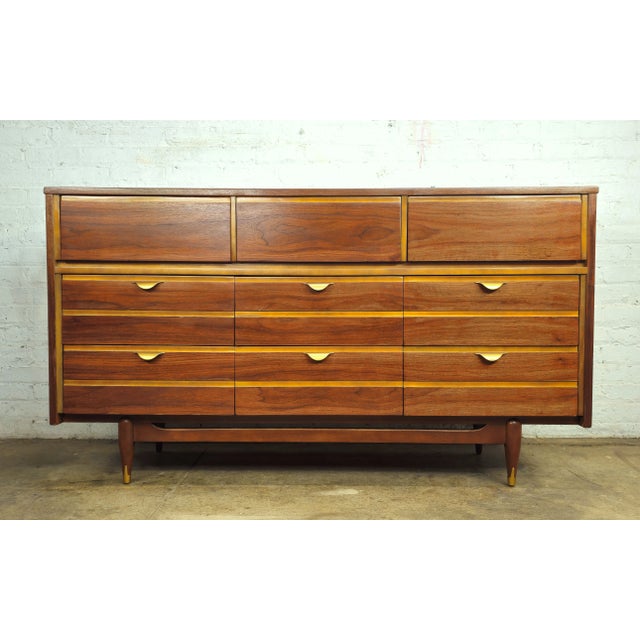 Refreshingly beautiful walnut mid century modern 9 drawer long dresser / low boy by popular mid century line, Mainline...