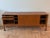 Beautiful and substantial vintage mid-century Danish modern teak credenza/sideboard with two sliding doors. One long...