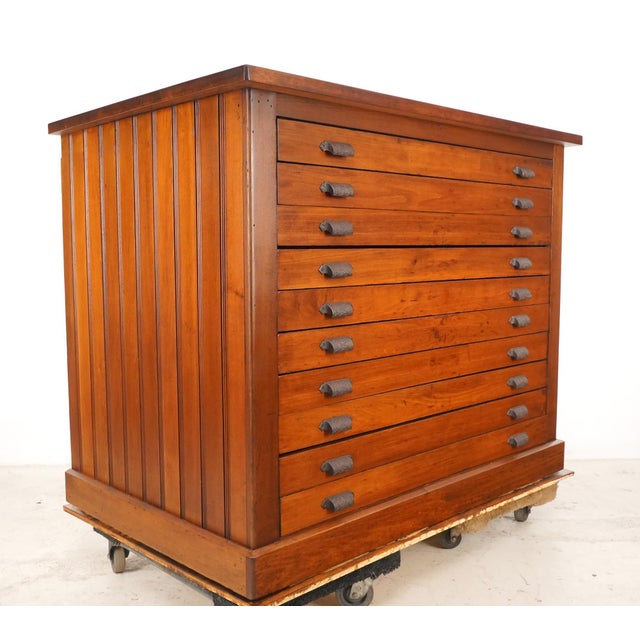 Vintage ten drawer flat file cabinet with Victorian cast iron bin pulls. Sleek, clean lines in solid wood construction...