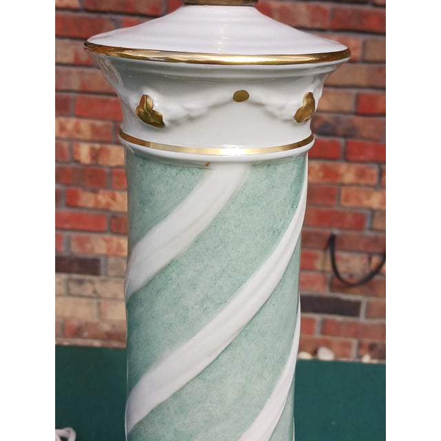 Fine pair of neoclassical tabletop torchieres with honeycomb milk glass shades. Both are signed Rembrandt near the socket.