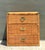This vintage woven rattan three-drawer chest is a beautifully preserved example of mid-century craftsmanship, celebrating...