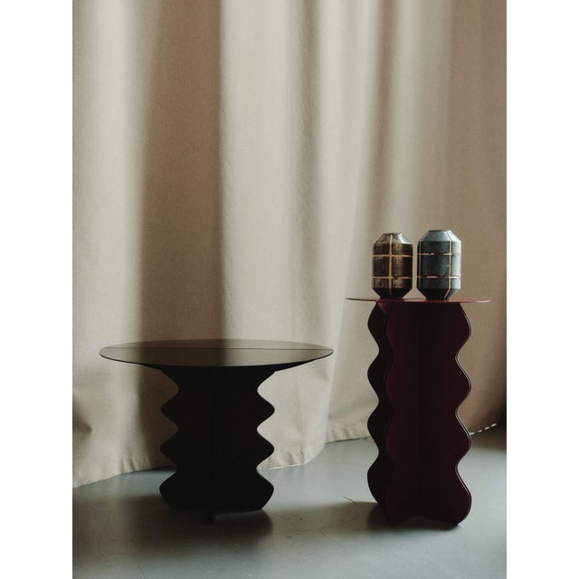 The "Hvylya" contemporary coffee table is a stunning fusion of sculptural art and functional design, where flowing waves...