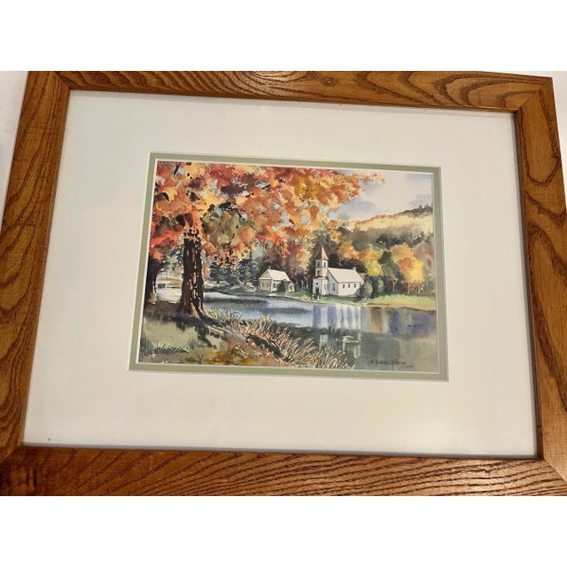 Susan Mangano Thirolle a Hudson Valley artist. A nice 1997 watercolor of a small church and house by the water in autumn....