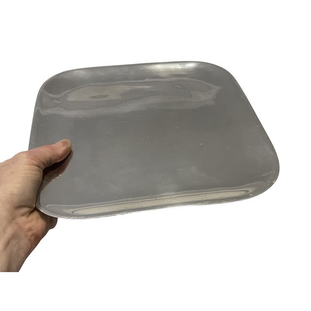 An exceptional example of mid-century American biomorphic design, this vintage Nambé No. 555 tray beautifully captures the...