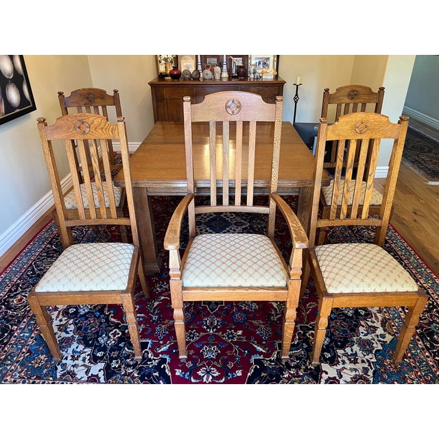 This vintage English table extends in size with a crank that opens the top of the table so that 1 or 2 extra leaf inserts...