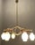 Italian geometric stilnovo chandelier from the 1950’s. wooden veneer metal frame with brass fittings. glass shades. height...