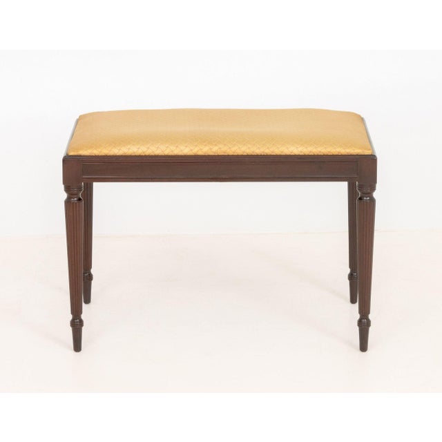 John Widdicomb Silk Upholstered Mahogany Bench, with caramel and pink basket-weave pattern upholstered seat above fluted...