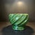 This MCM planter is a wonderful combination of color and form the dark bottle green ceramic is enhanced by the relief...