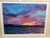 A beautifully executed gouache watercolor capturing a dramatic and richly colored sunset over water. The artist...