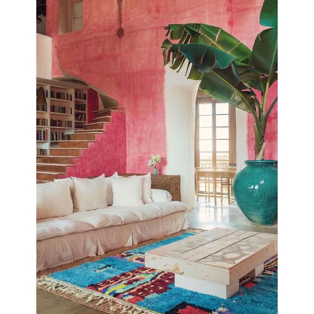 Boujad Rug | Handwoven Berber Wool Rug with Turquoise Field and Totemic Vessel Design This bold Boujad rug features a...