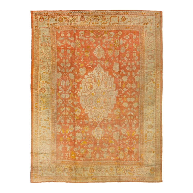 1880's Handmade Orange Turkish Oushak Wool Rug Featuring a Medallion Motif For Sale