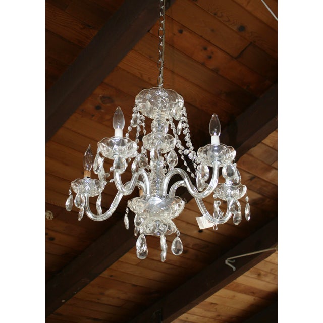 This beautiful vintage five-arm glass estate chandelier features cascading crystals that beautifully catch the light,...