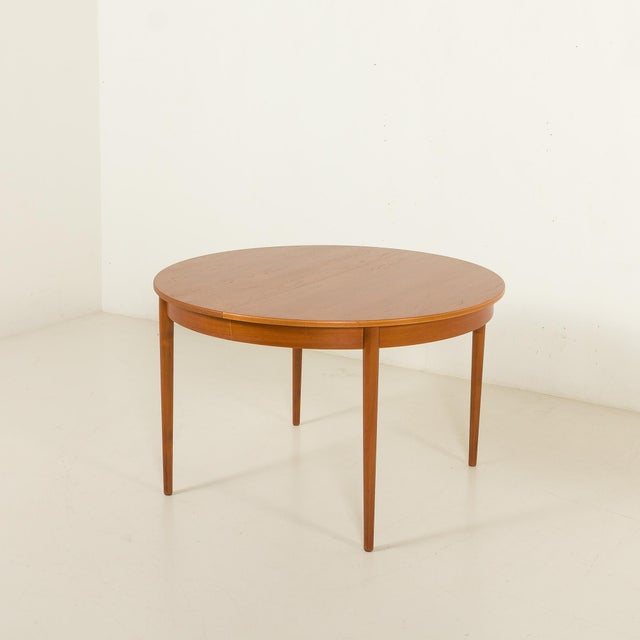 This classic Danish round teak expandable table was made in the 1960s. This piece exemplifies the craftsmanship and...