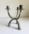 This brutalist-style verdigris candelabra is a vintage late 20th century sculptural piece characterized by its raw, heavy...