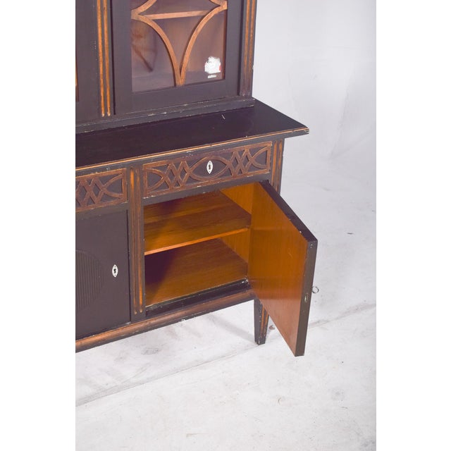 This rustic painted cupboard is a charming piece, likely Danish and dating from the mid-20th century. Its structure...