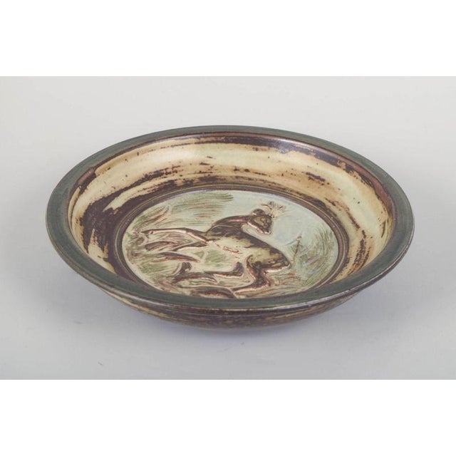 Knud Kyhn for Royal Copenhagen, stoneware dish. Decorative stoneware dish with a relief decoration depicting a deer in a...