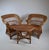 Sculptural Mid-Century side table featuring an unusual biomorphic free-form woven wicker top and an elaborate rattan base,...