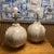 A sculptural pair of hand-thrown ceramic table lamps with an earthy matte mineral glaze—organic, timeless, and...