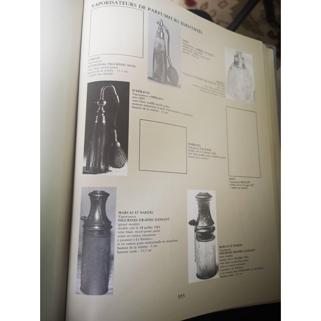 A René Lalique Perfume Bottle Atomizer. 'Origan'. A clear and black-enamelled atomiser with gilt-metal mount for D'Héraud...