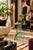 Striking 1980s Postmodern side table featuring an architectural, geometric design constructed entirely of thick glass. The...