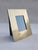 Gold-plated metal photo frame decorated with geometric lines, back support with wallet clasp. Made in Italy in the...