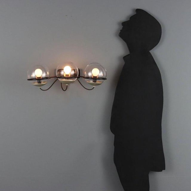Vintage wall lamp, model '237/3', designed by Gino Sarfatti for Arteluce in the 1960s. Black lacquered metal frame...