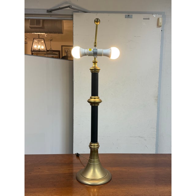 Design Plus Gallery presents a Chapman Table Lamp from 1972. The table lamp has a brass stem and base with a central are...