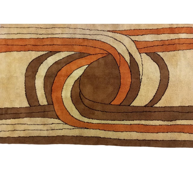 Modern designer rug measuring 287 cm x 186 cm, produced in the 1960s. Its tones range from light beige to dark brown,...