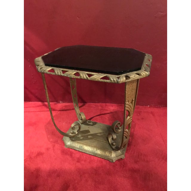 Please see photos for specifics . Is about 21 inches tall metal base in gold color and top made of vitrolite in good shape...