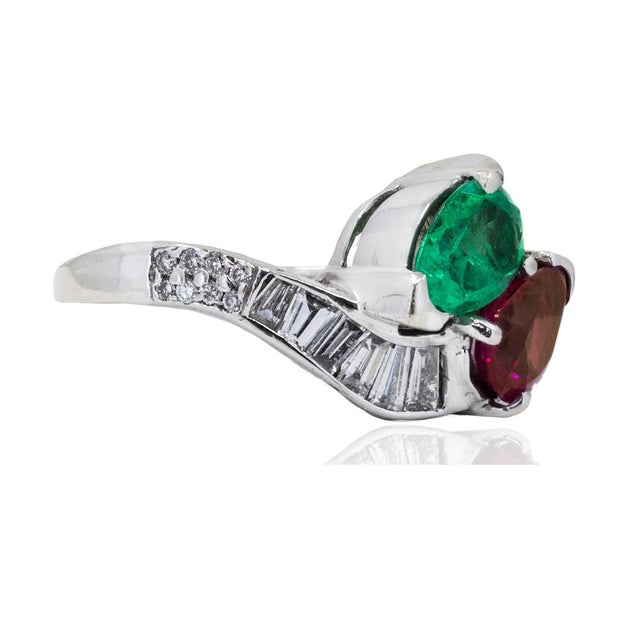 14k White gold bypass ring with 1.32 carat pear shape Burma Ruby, 0.92 carat Colombian emerald, 16 round diamonds weighing...