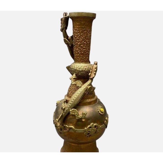 Impressive vintage Tibetan or Sino-Tibetan ritual vase, circa 1950–1970. Cast bronze with gilt brass detailing, featuring...