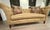Chesterfield-style sofa with a contemporary update, suitable for modern decor preferences. It features classic deep...