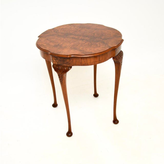 A beautiful and elegant antique burr walnut occasional side table. This was made in England, it dates from around the...