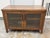 Design Plus Gallery presents a Bespoke Media Cabinet. The cabinet is constructed in walnut-toned wood with a broad...