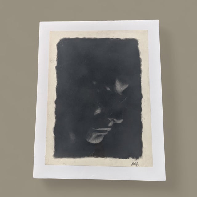 An Original Charcoal Pastel Drawing of a Contemplative Man's Profile Signed by the Artist Unframed, but wrapped in...