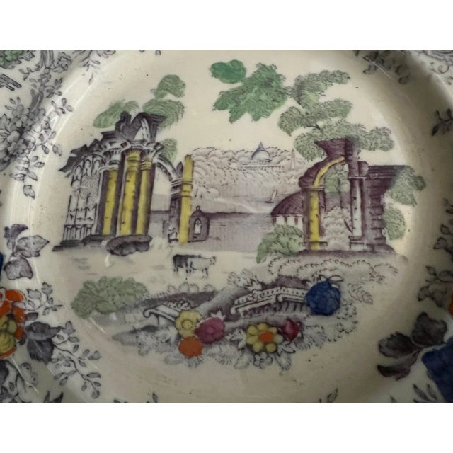 A beautifully hand painted Edwardian era Mason's Ironstone plate with columns and florals. England, circa 1900s.