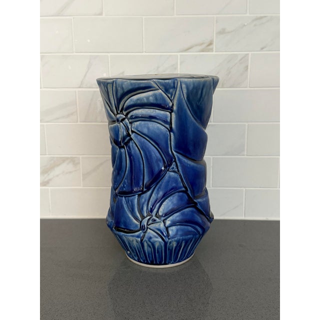 We love the organic design of this handmade studio pottery vase! The body features an abstract “carved” nautilus shell...