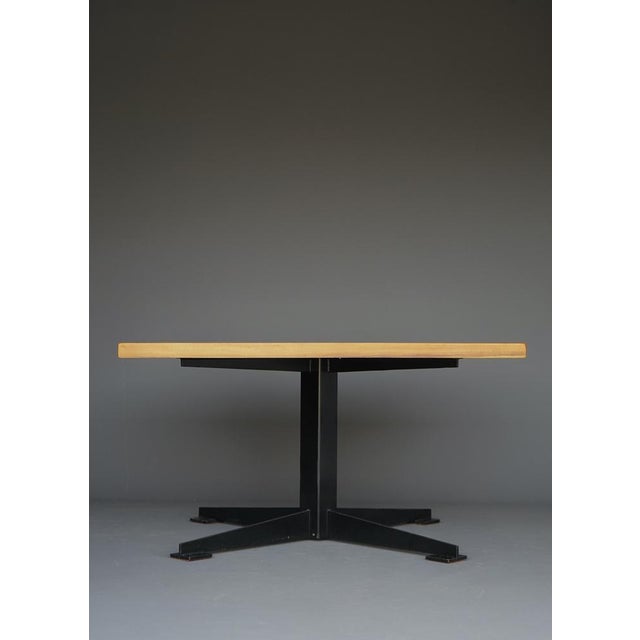A bespoke dining table by Dutch modernist architect Wim den Boon. The table features a thick solid cherry wood top on a...