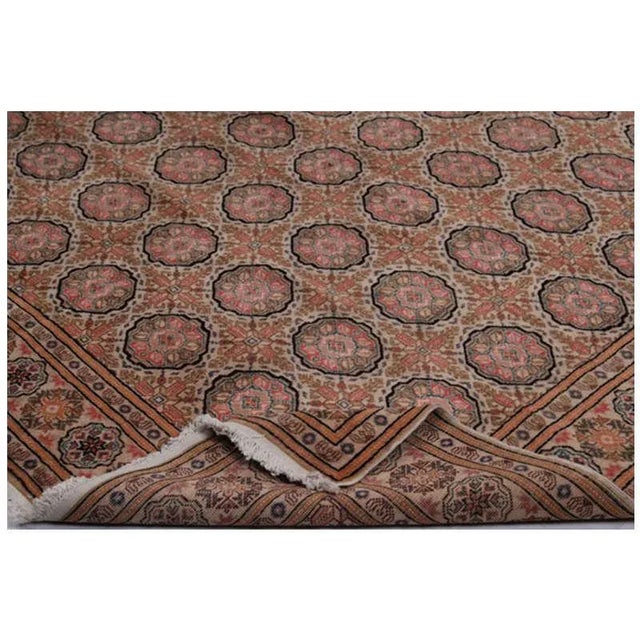 Old handwoven Turkish Kaisari rug featuring a Gole (Flower) / Elephant footprint design, with an ivory-colored background...