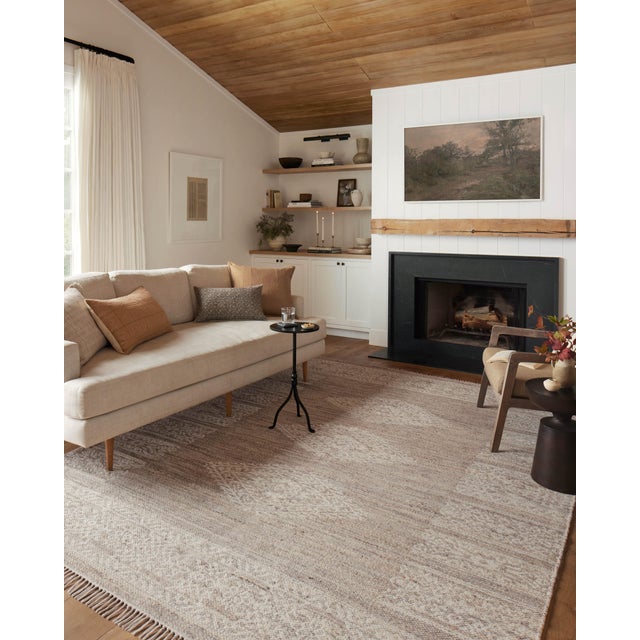 The Rivers Collection by Angela Rose x Loloi is a modern flatweave area rug with a reversible design featuring symmetrical...