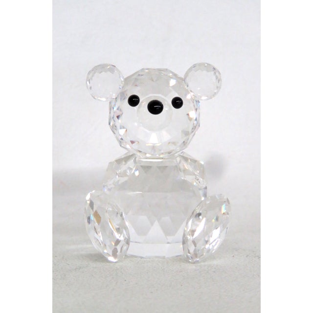This lovely Miniature Figurine is made of clear crystal. This darling collectible is the Swarovski Crystal Teddy Bear from...